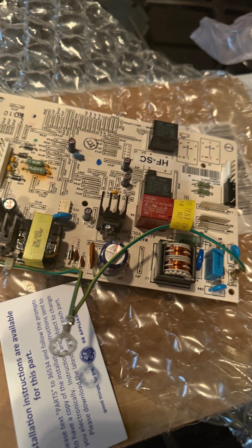 Close view of GE refrigerator main control board